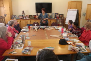 A group of people sitting around a table.