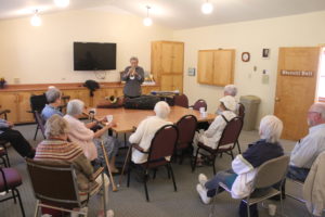 A group of people sitting around a table.